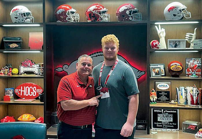 Wakeland High School offensive lineman Connor Stroh hangs out with Arkansas coach Sam Pittman during an April visit to Fayetteville. It was Stroh's second time to make the drive from Frisco, Texas in the span of just a few months.
